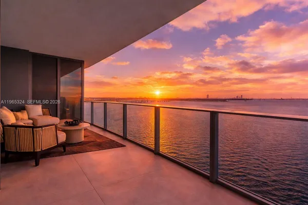 a balcony with chairs