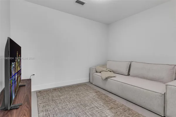 a bedroom with a bed and a shower