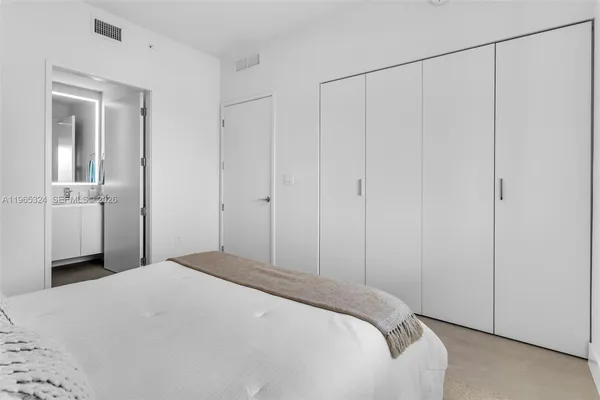 a view of a backyard with plants and swimming pool