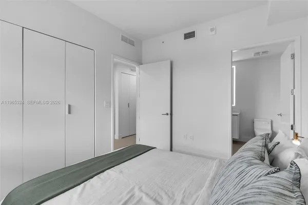 a view of a living room and workspace