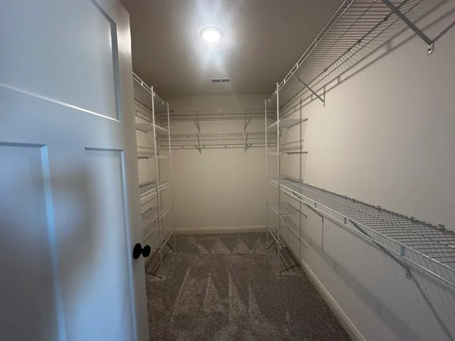 a view of a room with racks on the wall