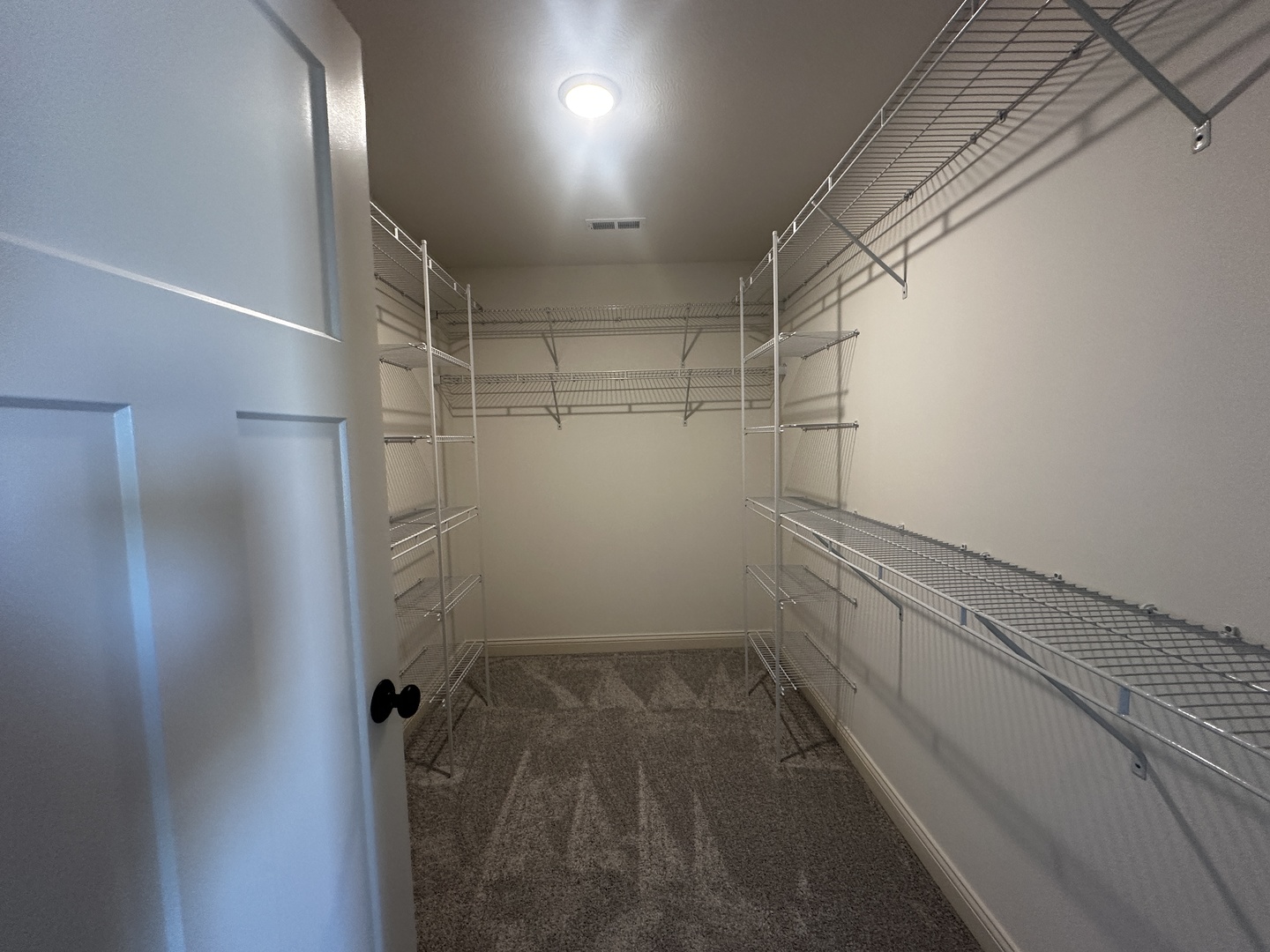 1710 Bluestone Drive Normal, IL 61761 - Photo 11 of 18 a view of a room with racks on the wall