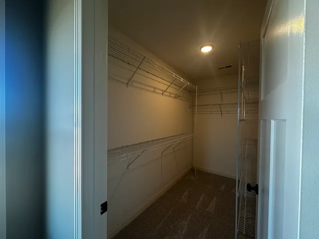 a bathroom with a glass door shower