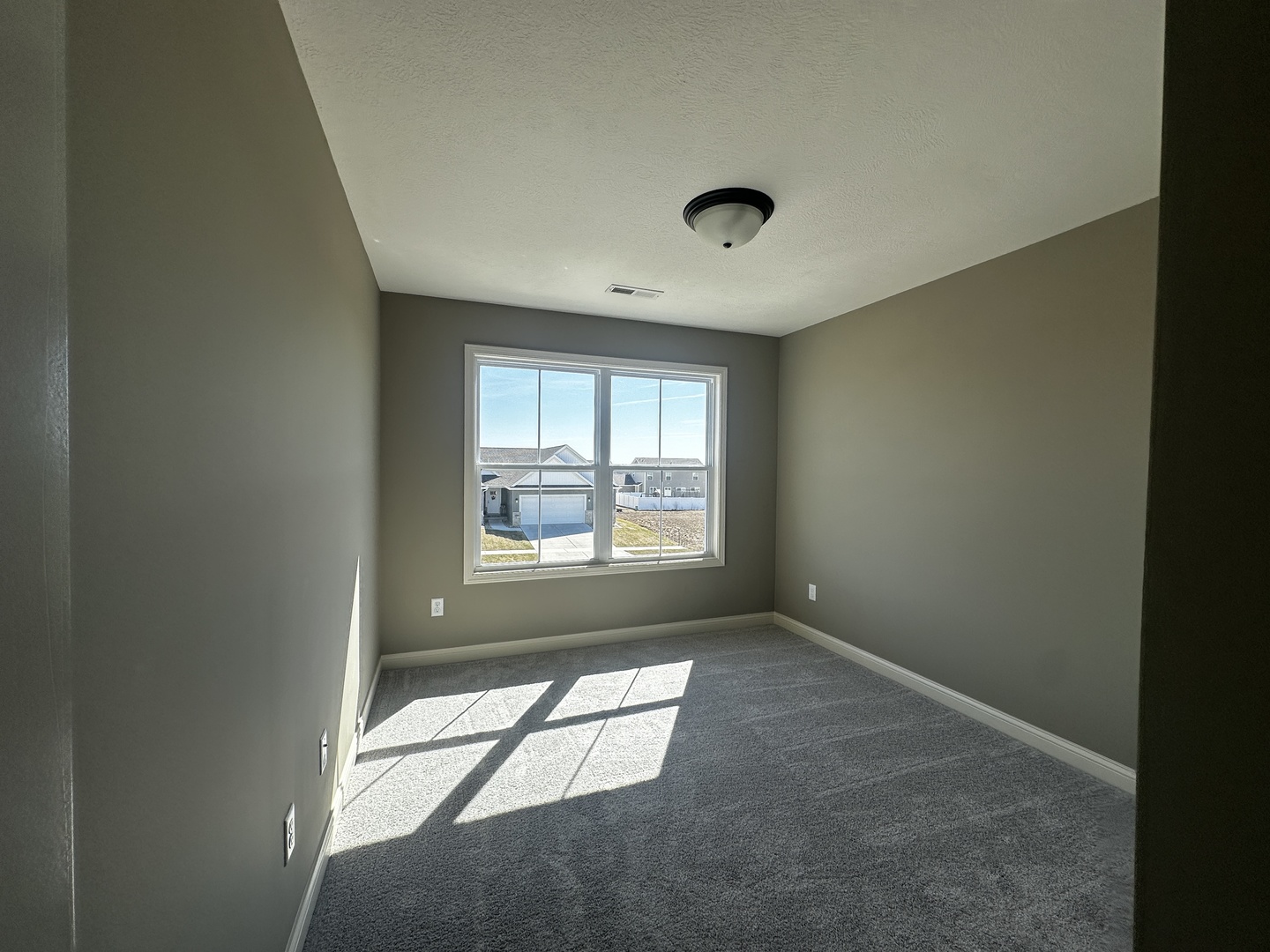 1710 Bluestone Drive Normal, IL 61761 - Photo 16 of 18 an empty room with a empty space and windows