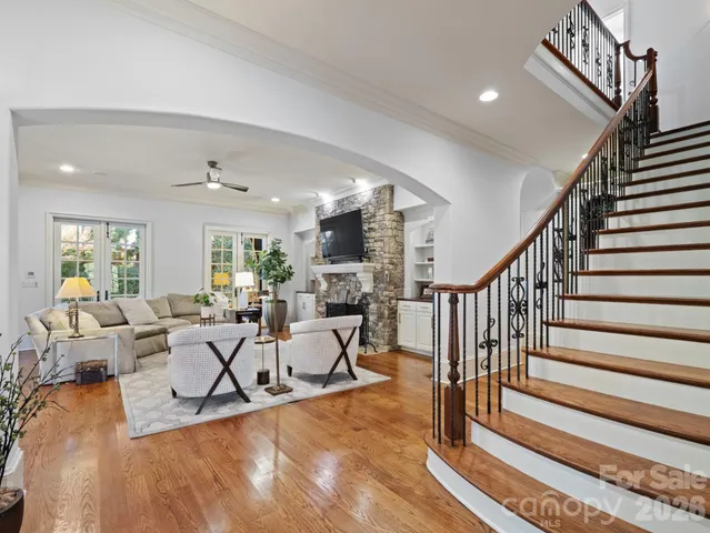 a living room with furniture or stairs and a dining table