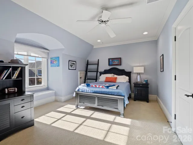 a bed room with a bed and a tv