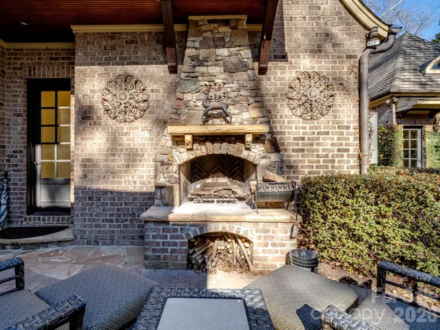 a room with a fireplace and painted walls