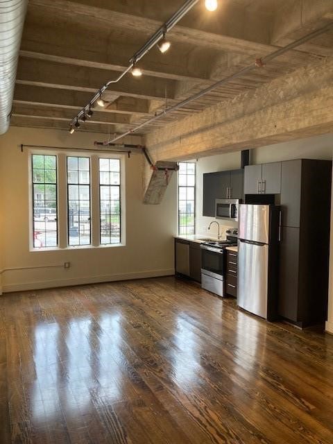 4411 Dallas Street, Unit 1 Houston, TX 77023 - Photo 2 of 13 a view of kitchen with refrigerator and wooden floor