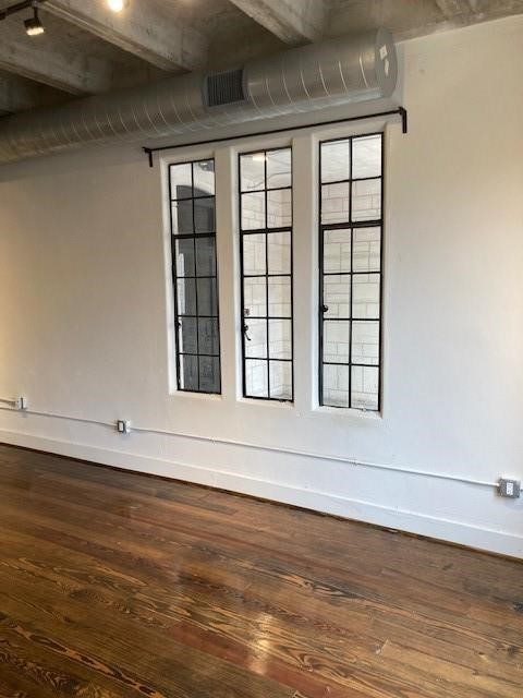 4411 Dallas Street, Unit 1 Houston, TX 77023 - Photo 6 of 13 a view of wooden floor and windows in a room