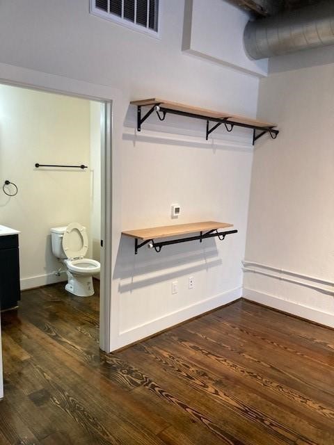4411 Dallas Street, Unit 1 Houston, TX 77023 - Photo 7 of 13 a view of a room with wooden floor and chair