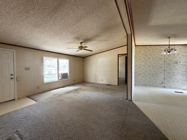 a view of empty room with windows