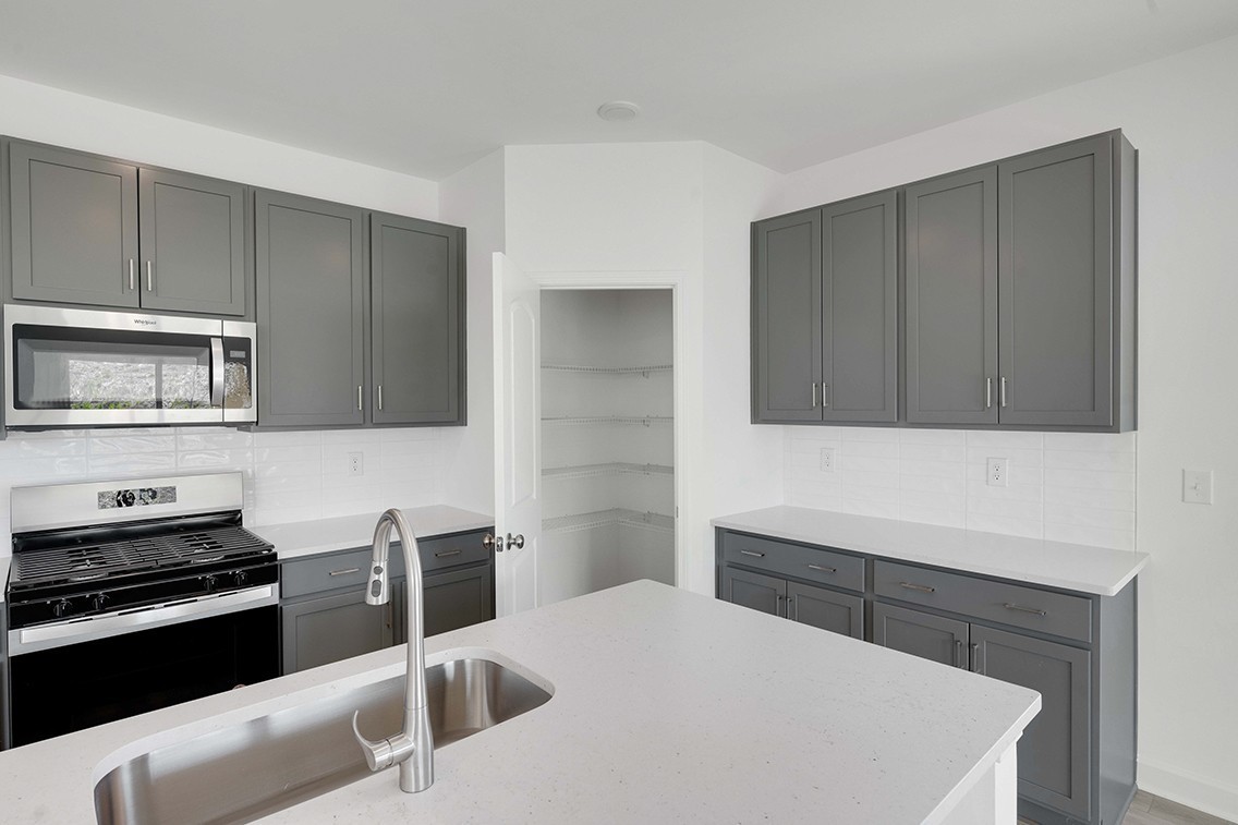 199 East Millbrook Drive Spring Hill, TN 37174 - Photo 12 of 32 a kitchen with a appliances and cabinets