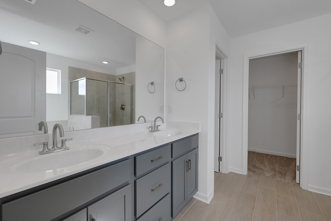 199 East Millbrook Drive Spring Hill, TN 37174 - Photo 18 of 32 a bathroom with a sink double vanity and a mirror