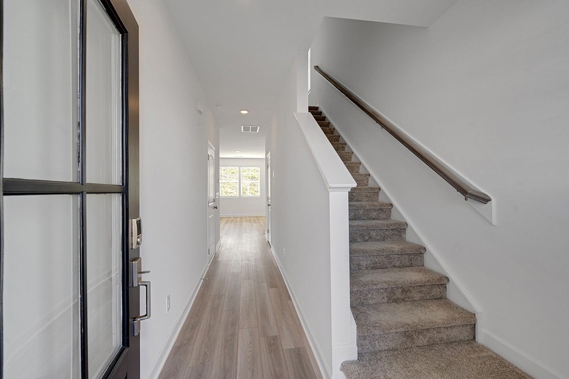 199 East Millbrook Drive Spring Hill, TN 37174 - Photo 5 of 32 a view of entryway with wooden floor and stairs