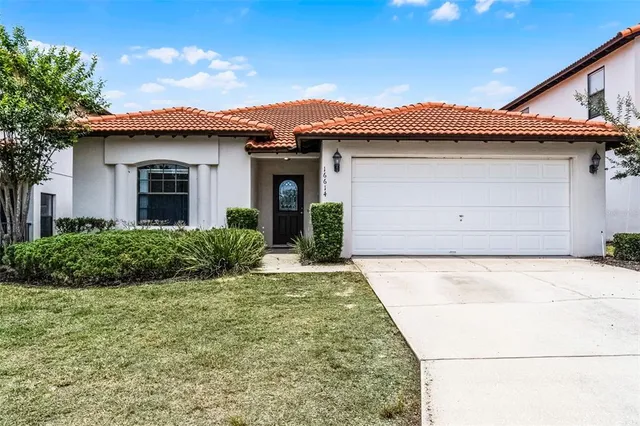 a view of a house with a yard