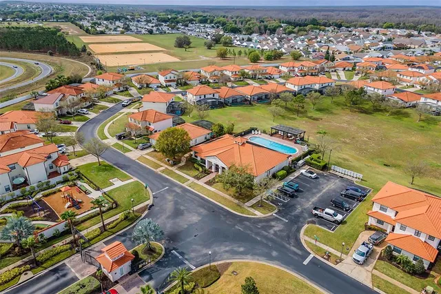 an aerial view of a house with a swimming pool