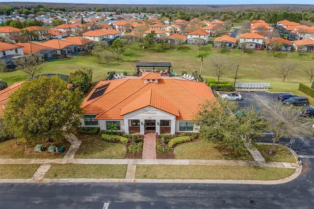 an aerial view of a house with a swimming pool