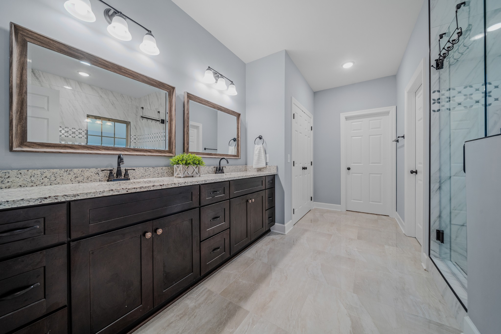 7998 Miller Road Christiana, TN 37037 - Photo 18 of 43 a spacious bathroom with a double vanity sink mirror double and shower