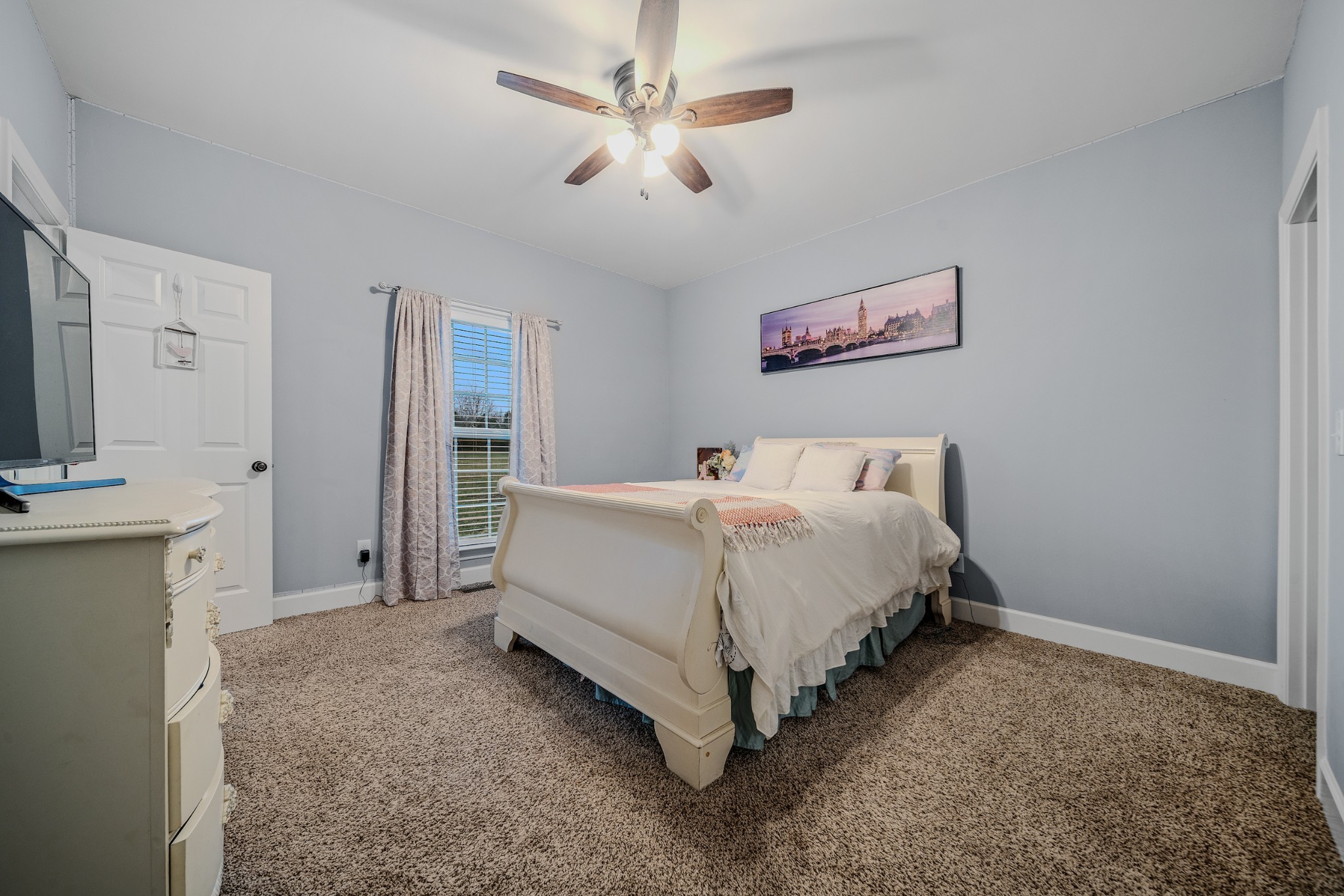 7998 Miller Road Christiana, TN 37037 - Photo 22 of 43 a bed room with a bed and a television