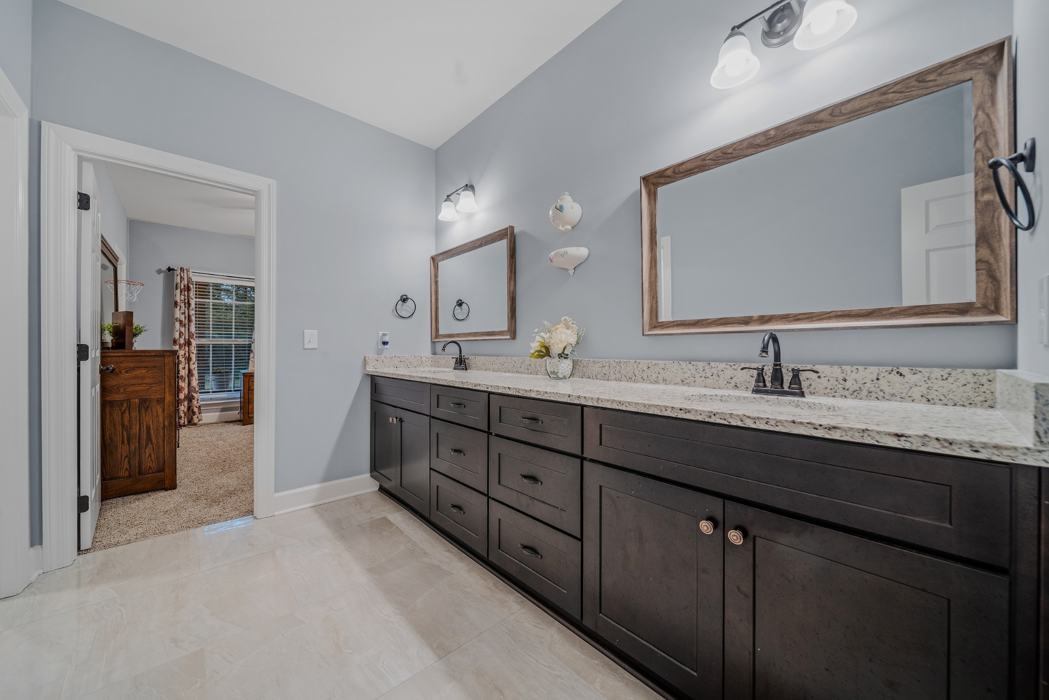 7998 Miller Road Christiana, TN 37037 - Photo 24 of 43 a en suite bathroom with double sink and a mirror