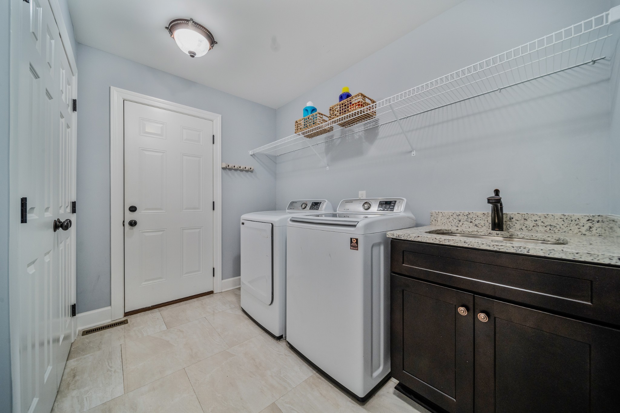 7998 Miller Road Christiana, TN 37037 - Photo 27 of 43 a utility room with cabinets washer and dryer