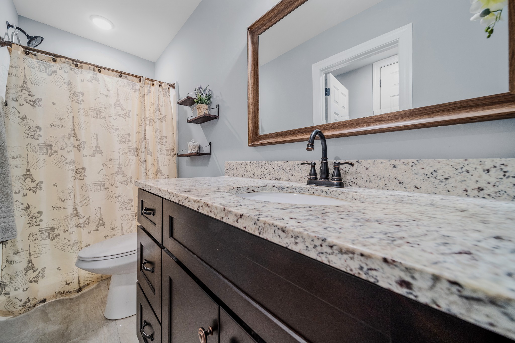 7998 Miller Road Christiana, TN 37037 - Photo 31 of 43 a bathroom with a granite countertop sink and a toilet