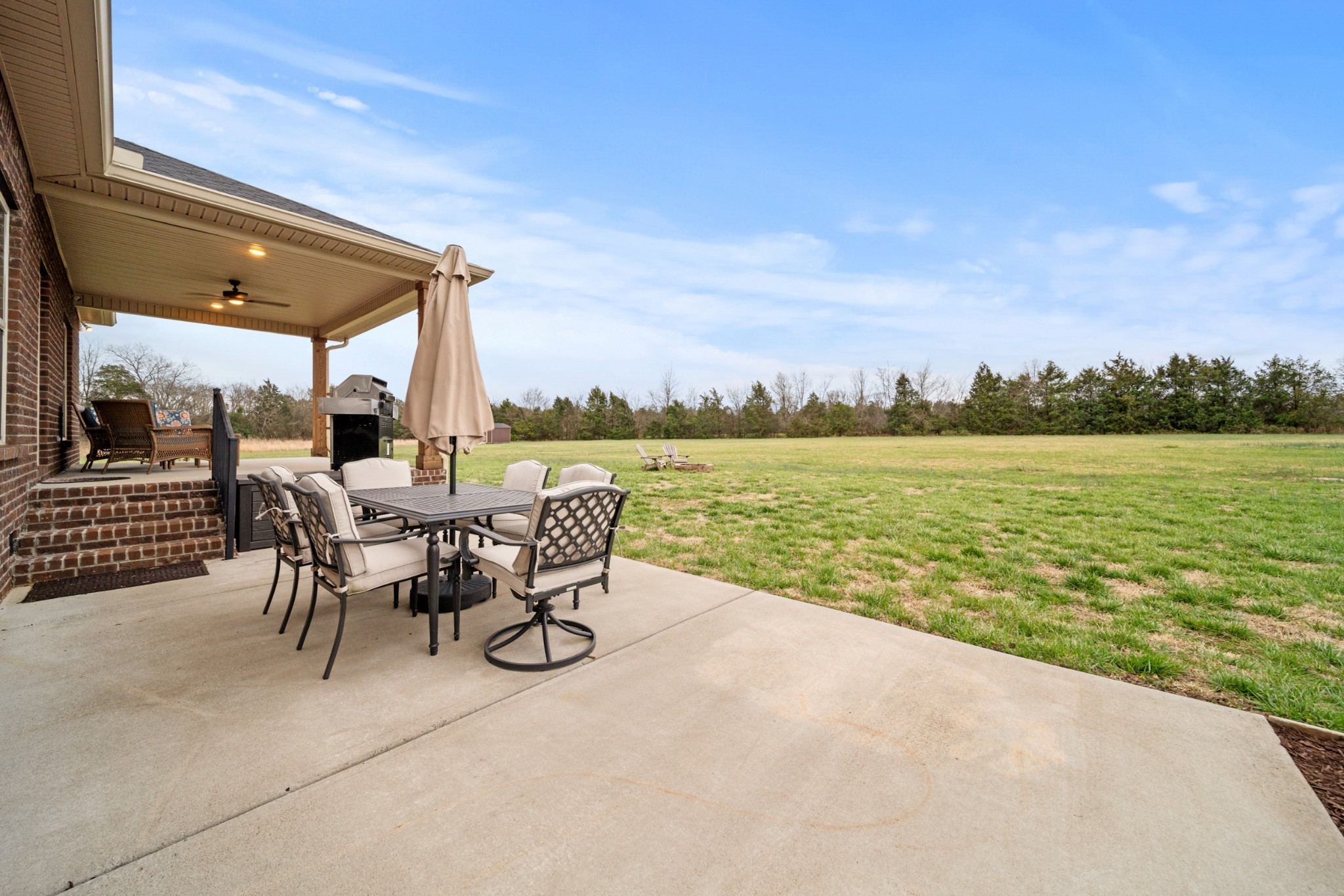 7998 Miller Road Christiana, TN 37037 - Photo 35 of 43 a view of a patio with a table and chairs