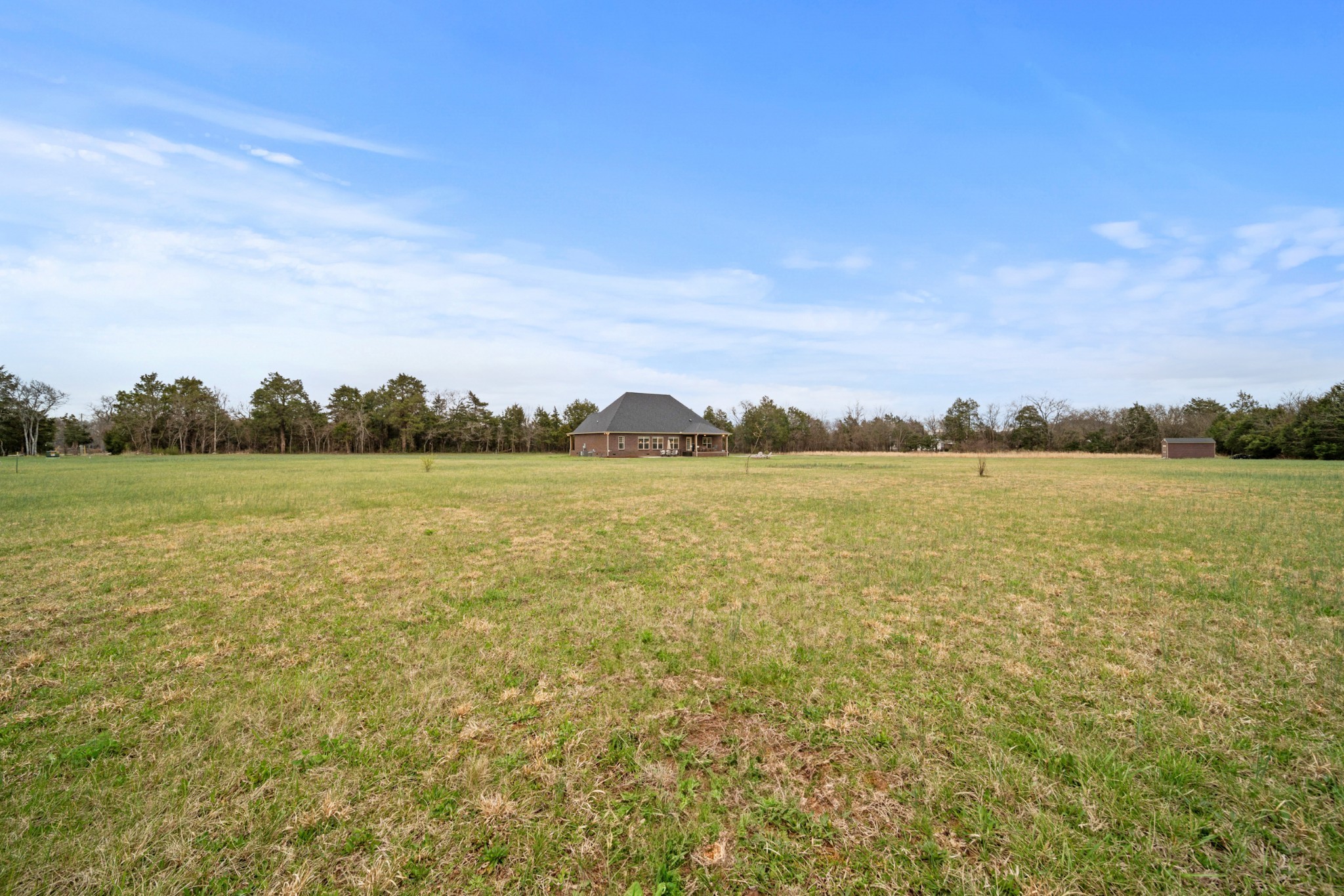 7998 Miller Road Christiana, TN 37037 - Photo 40 of 43 a view of a lake with houses in the back