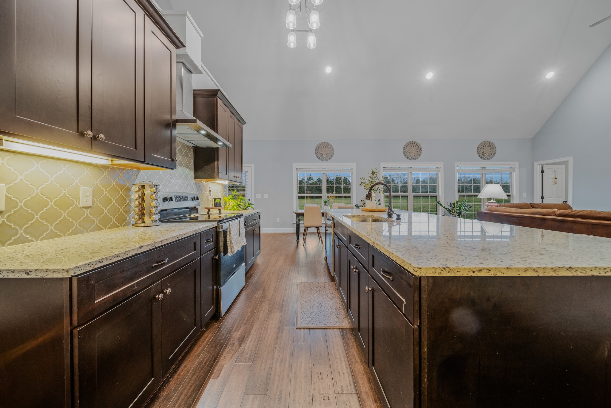 7998 Miller Road Christiana, TN 37037 - Photo 9 of 43 a kitchen with stainless steel appliances granite countertop a sink a stove and a wooden cabinets