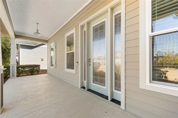 a view of a porch with a floor to ceiling window