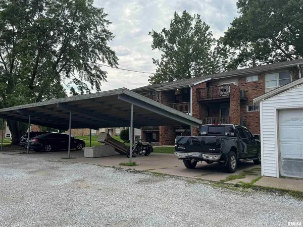 a view of a car park in front of house