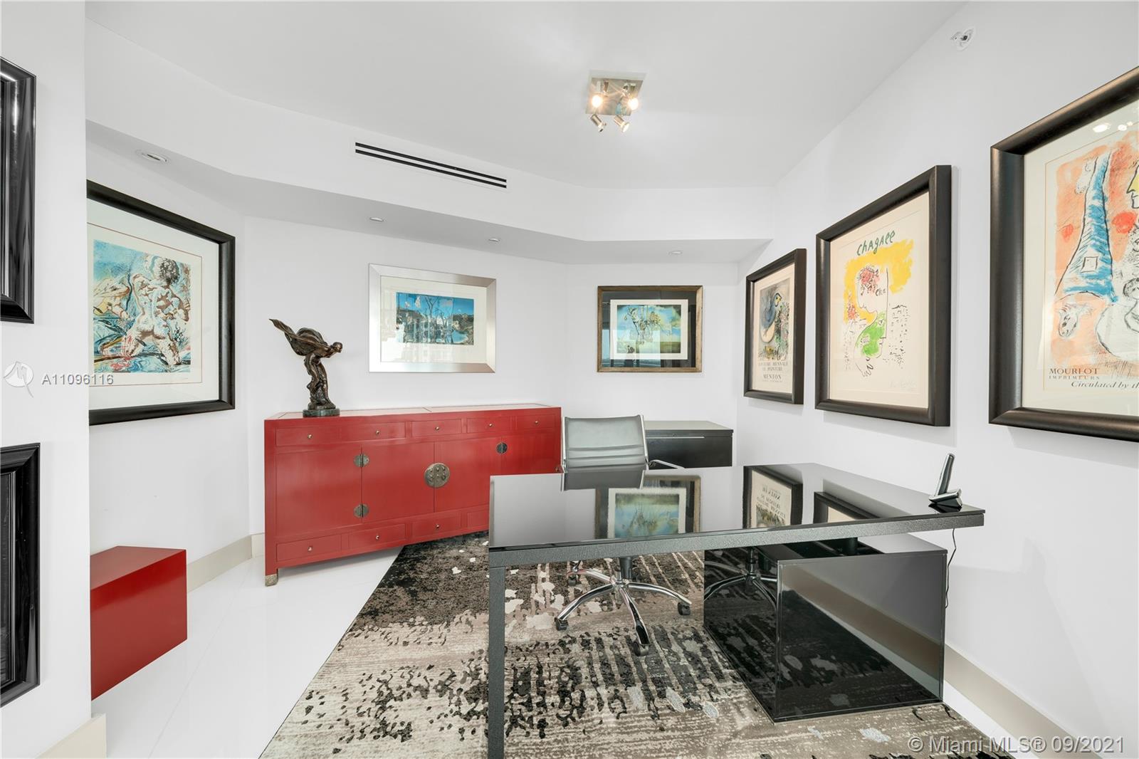 2127 Brickell Avenue, Unit 1602 Miami, FL 33129 - Photo 11 of 40 a living room with furniture and a window