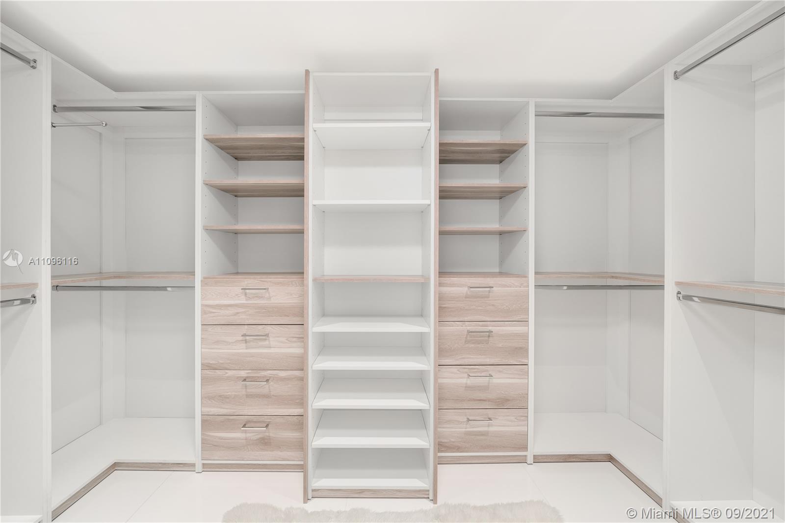 2127 Brickell Avenue, Unit 1602 Miami, FL 33129 - Photo 16 of 40 a view of walk in closet with empty racks