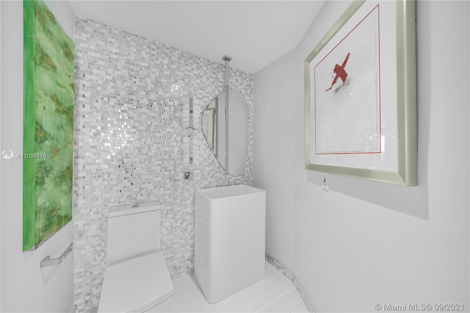 2127 Brickell Avenue, Unit 1602 Miami, FL 33129 - Photo 21 of 40 a bathroom with a bathtub and shower