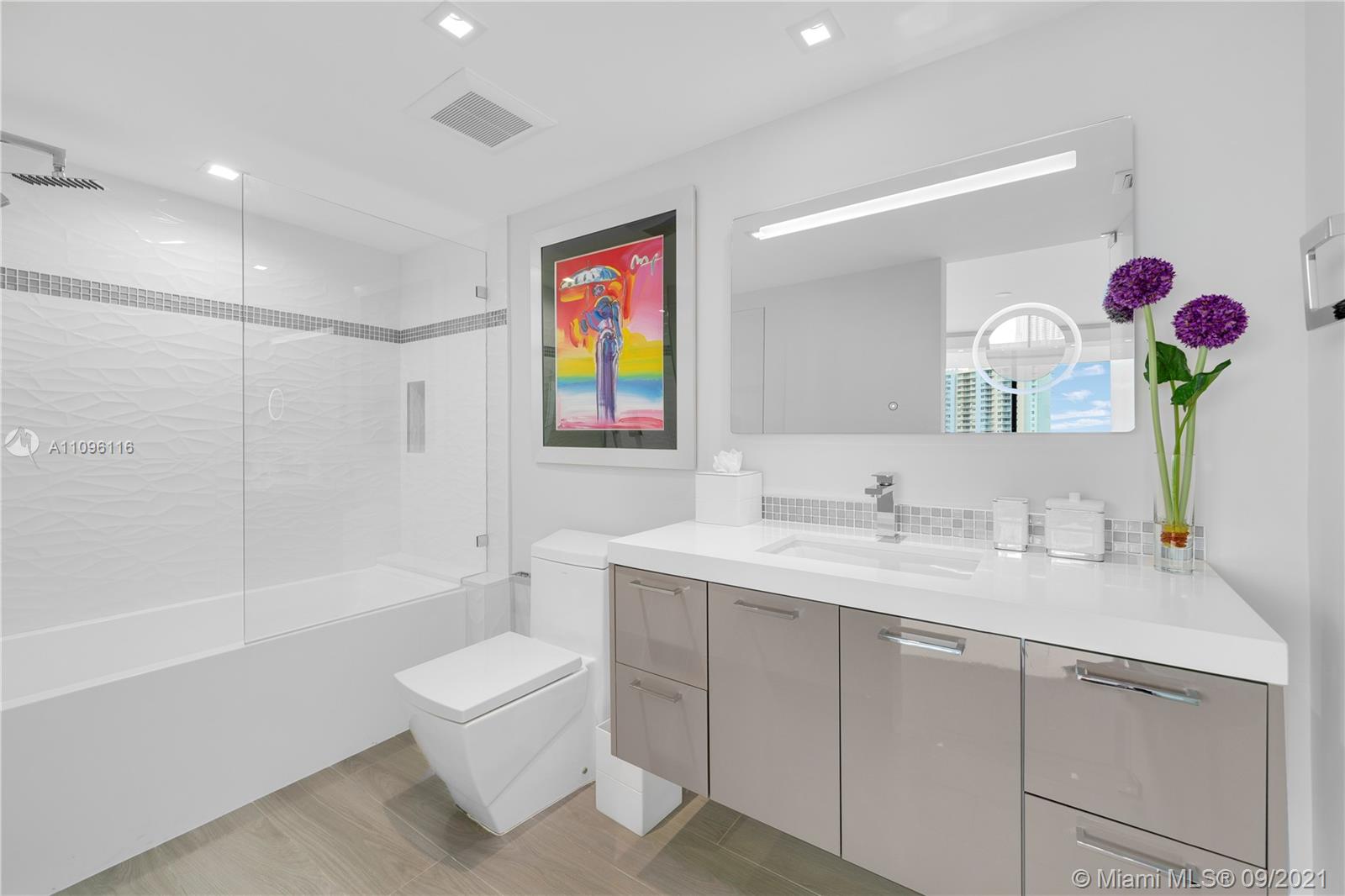 2127 Brickell Avenue, Unit 1602 Miami, FL 33129 - Photo 27 of 40 a bathroom with a sink a toilet and a bathtub