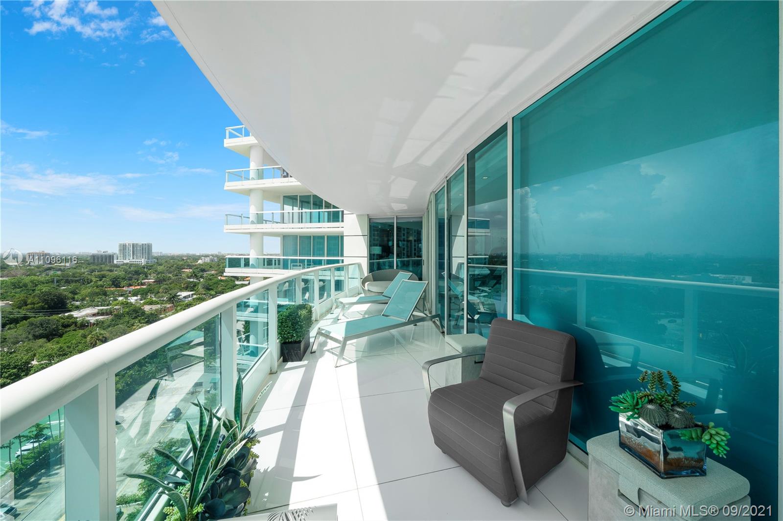 2127 Brickell Avenue, Unit 1602 Miami, FL 33129 - Photo 29 of 40 a view of a chair and tables in the balcony
