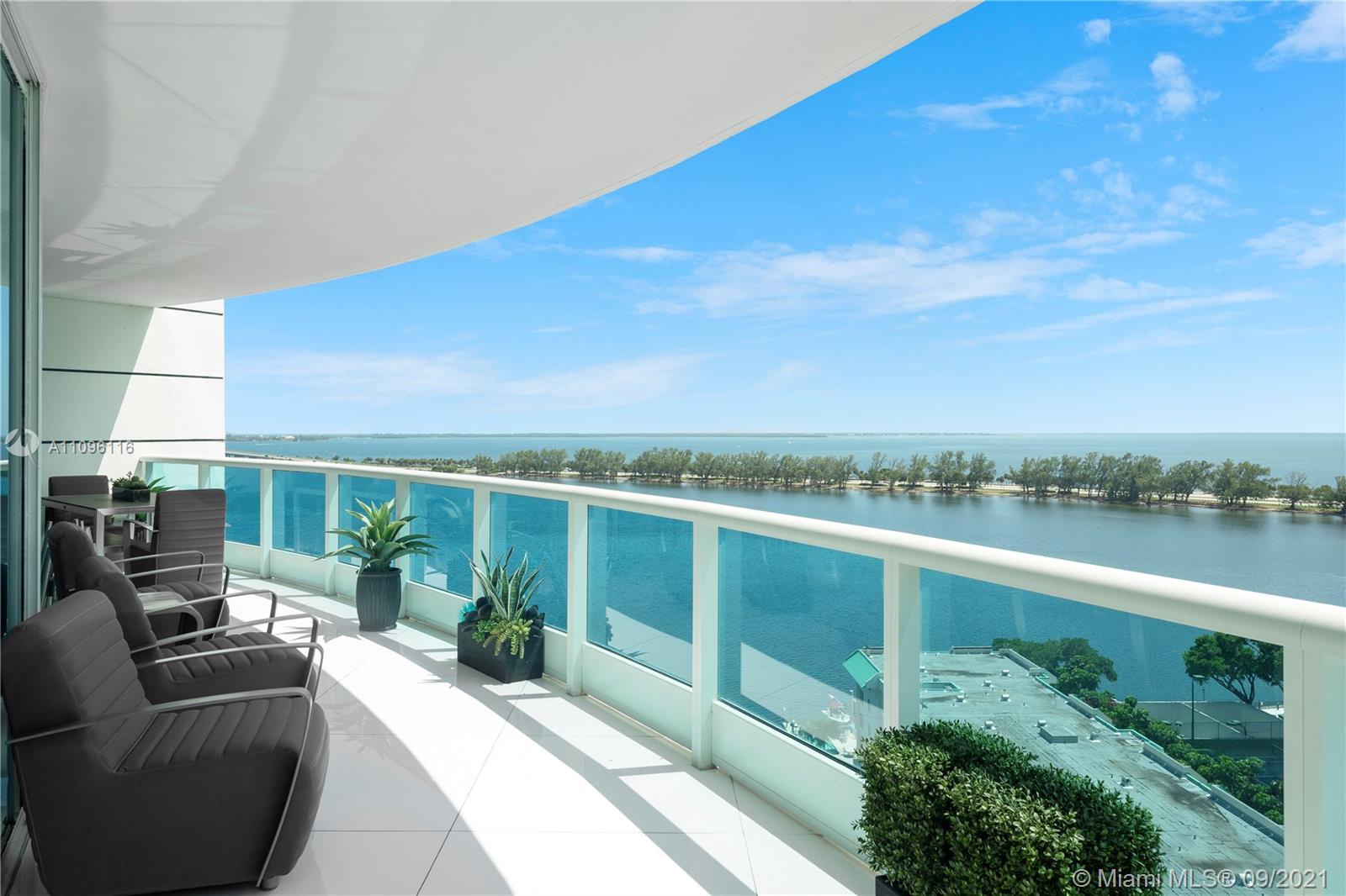 2127 Brickell Avenue, Unit 1602 Miami, FL 33129 - Photo 30 of 40 a view of a balcony with couch and wooden floor