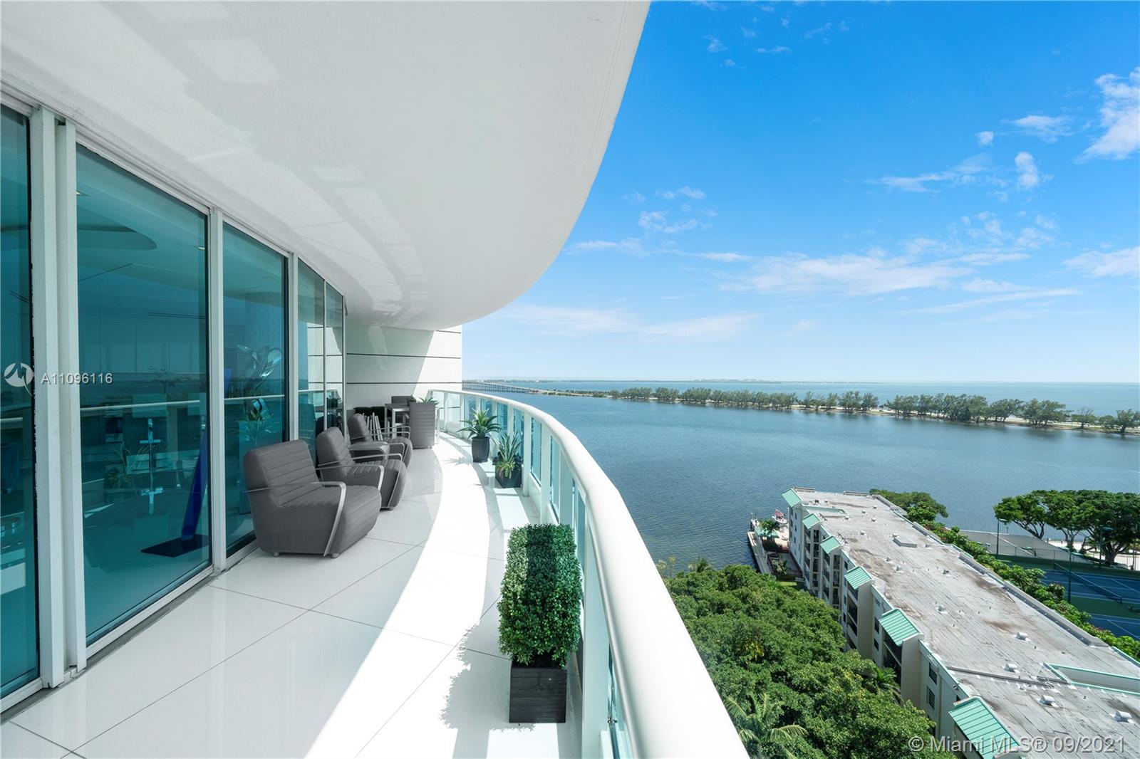 2127 Brickell Avenue, Unit 1602 Miami, FL 33129 - Photo 4 of 40 a view of a balcony with lake view and a potted plant