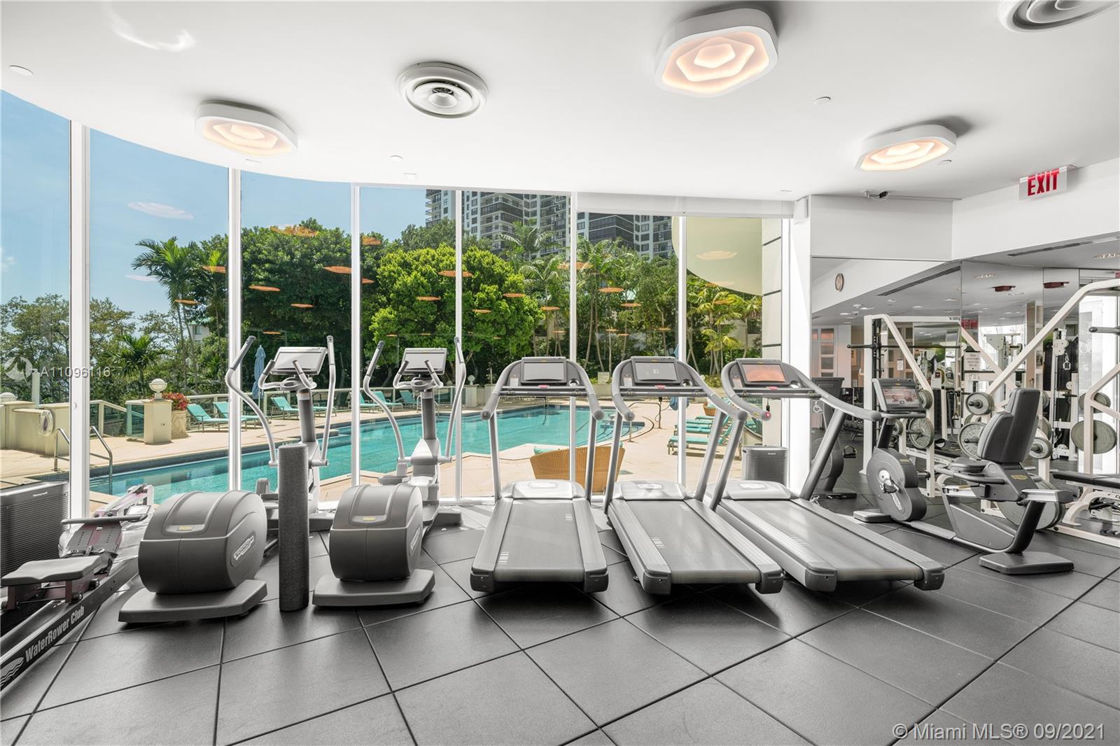2127 Brickell Avenue, Unit 1602 Miami, FL 33129 - Photo 36 of 40 a view of a livingroom with furniture and floor to ceiling window