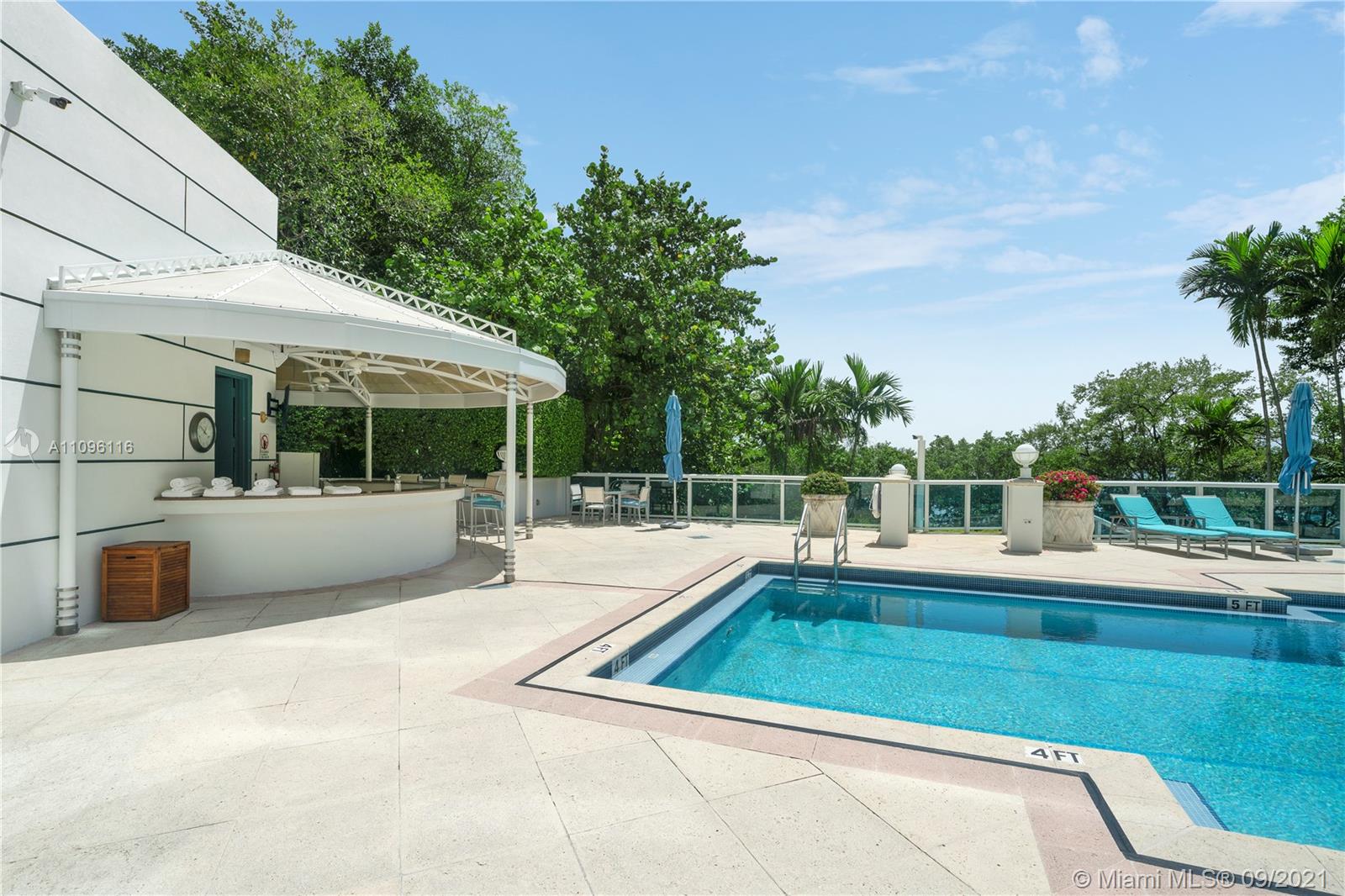2127 Brickell Avenue, Unit 1602 Miami, FL 33129 - Photo 38 of 40 a view of a white house with a swimming pool