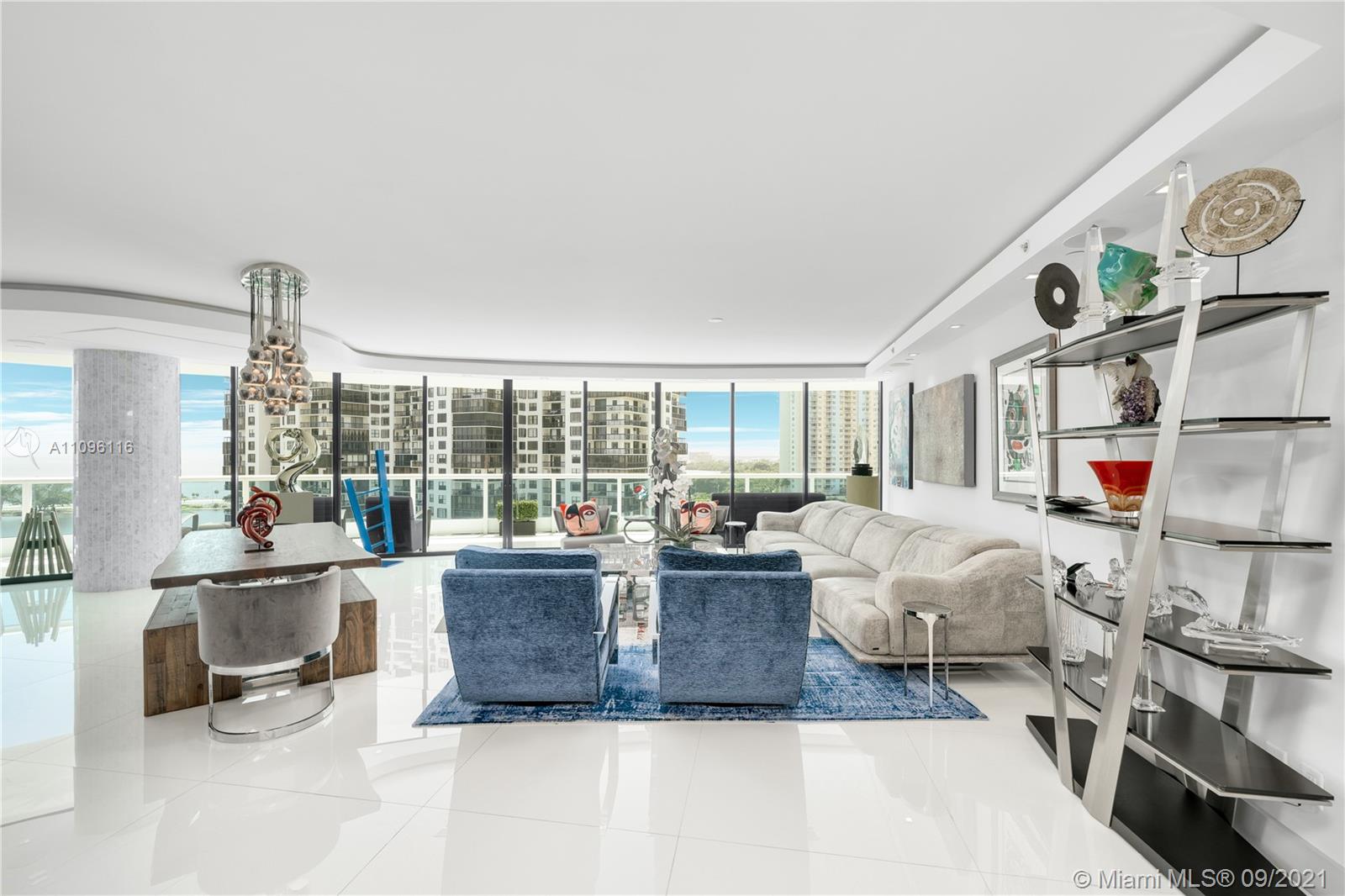 2127 Brickell Avenue, Unit 1602 Miami, FL 33129 - Photo 8 of 40 a living room with furniture and a large window