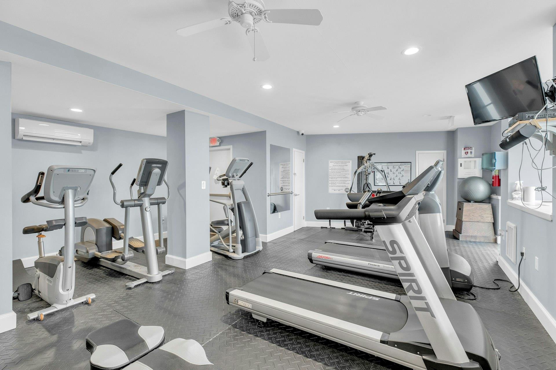 585 Dune Road, Unit L9 Westhampton, NY 11978 - Photo 13 of 20 a view of a room with gym equipment
