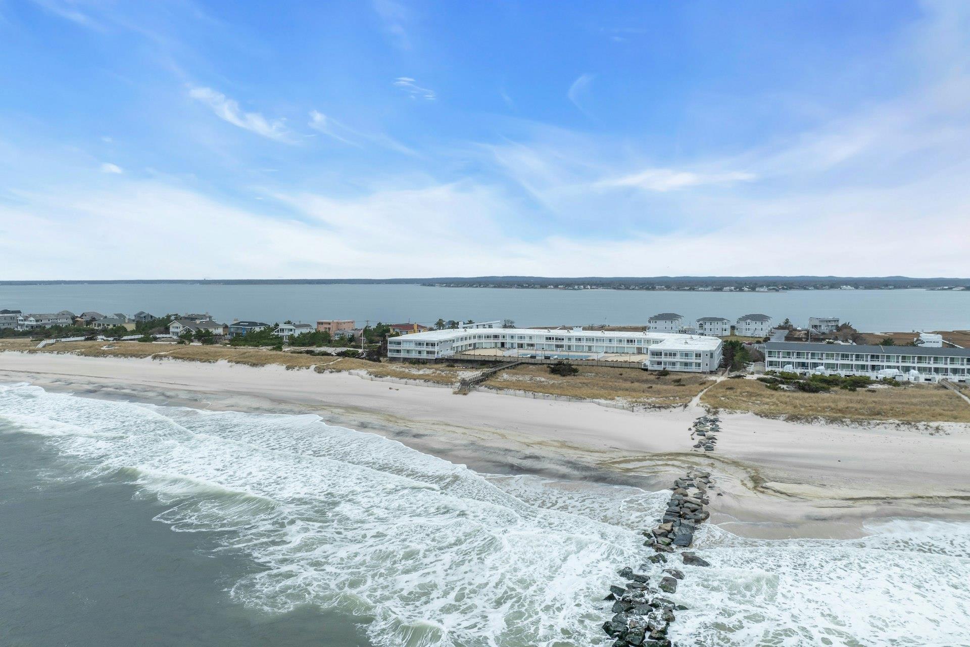 585 Dune Road, Unit L9 Westhampton, NY 11978 - Photo 17 of 20 a view of an ocean beach