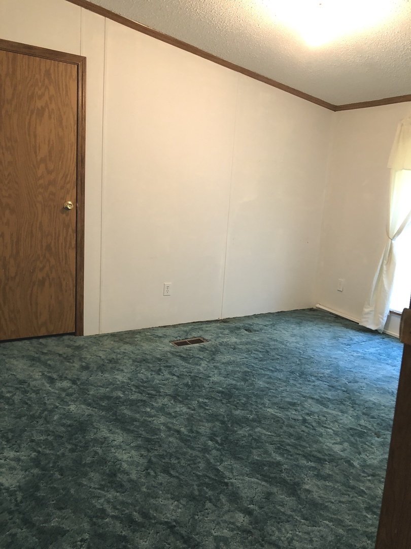 29134 North 3400 E Road Dwight, IL 60420 - Photo 12 of 27 an empty room with a wooden floor and a window