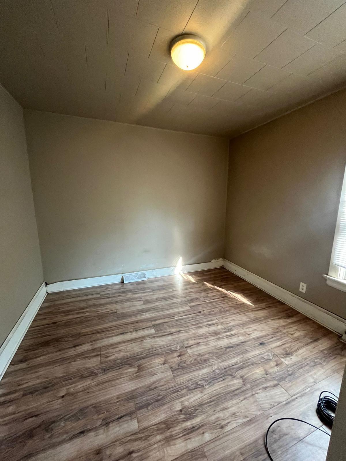 769 Buchanan Street Gary, IN 46402 - Photo 11 of 28 a view of empty room with wooden floor