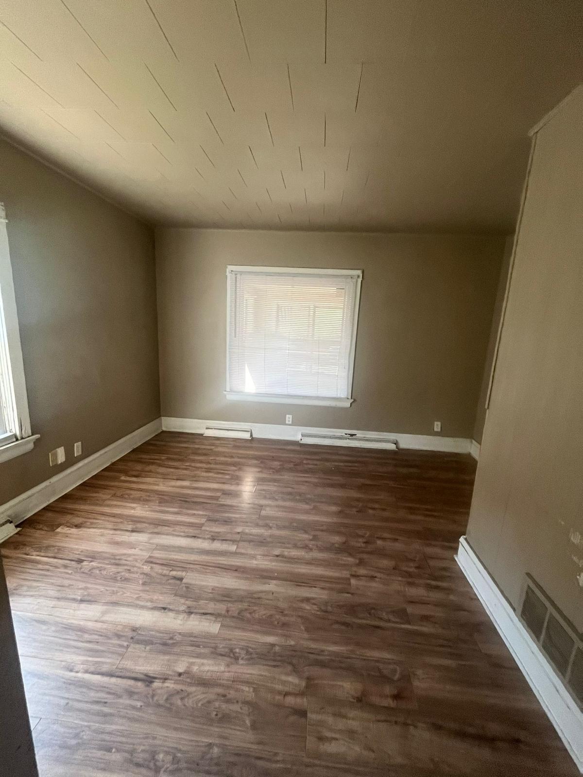 769 Buchanan Street Gary, IN 46402 - Photo 14 of 28 wooden floor in an empty room