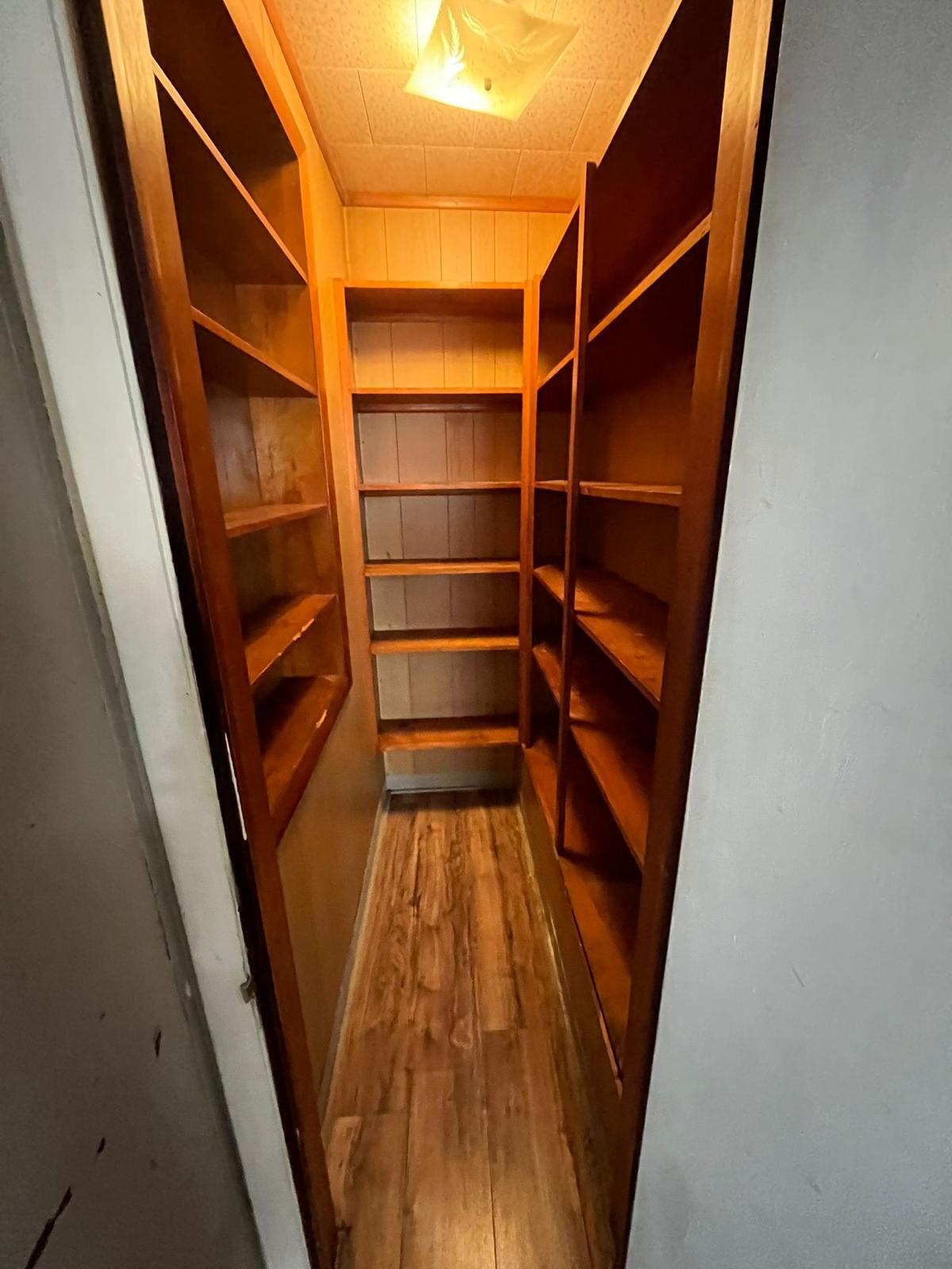 769 Buchanan Street Gary, IN 46402 - Photo 16 of 28 a view of walk in closet with empty racks
