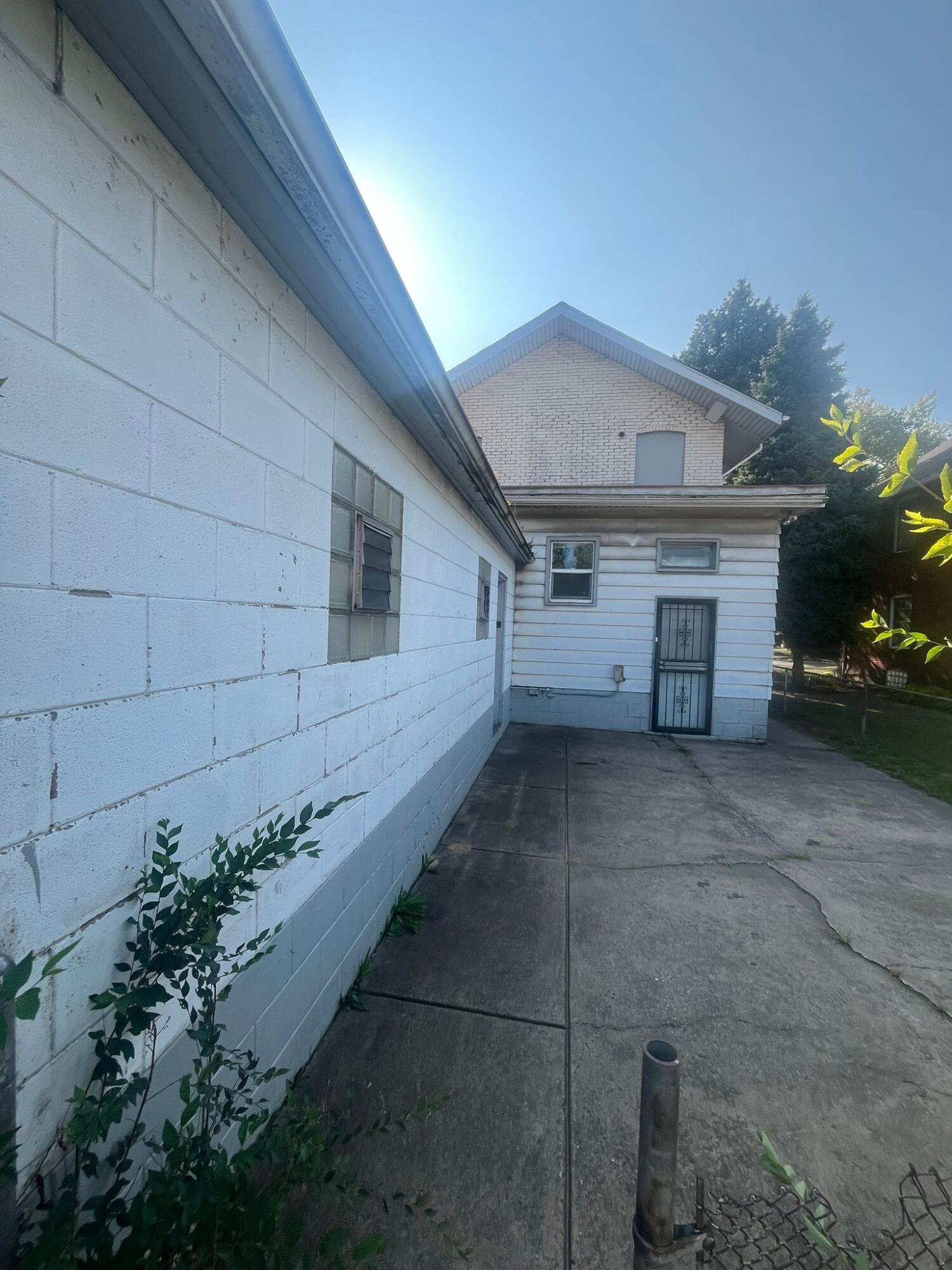 769 Buchanan Street Gary, IN 46402 - Photo 3 of 28 a view of a house with a garage