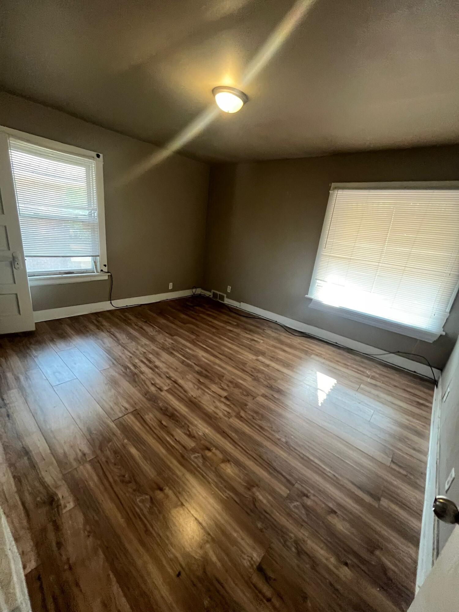 769 Buchanan Street Gary, IN 46402 - Photo 5 of 28 a view of an empty room and window