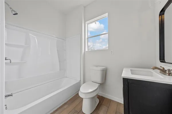 a bathroom with a toilet sink and bathtub